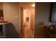 Hallway leading to a bathroom, enhanced by light, modern flooring at 805 N 4Th Ave # 903, Phoenix, AZ 85003