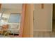 Hallway featuring a glimpse into the living room with view of a painting at 805 N 4Th Ave # 903, Phoenix, AZ 85003