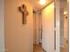 Hallway with warm lighting, a decorative cross, and multiple doors at 805 N 4Th Ave # 903, Phoenix, AZ 85003