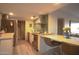 An updated kitchen with modern tile backsplash and breakfast bar seating at 805 N 4Th Ave # 903, Phoenix, AZ 85003