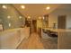 Well lit eat-in kitchen featuring a contrasting backsplash and pendant lighting at 805 N 4Th Ave # 903, Phoenix, AZ 85003