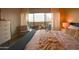 Bright bedroom with a large window and balcony overlooking a skyline at 805 N 4Th Ave # 903, Phoenix, AZ 85003