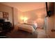 Comfortable main bedroom featuring a bed with decorative pillows, modern decor, and a dedicated desk space at 805 N 4Th Ave # 903, Phoenix, AZ 85003
