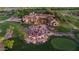 Aerial view of a large outdoor party with string lights at a community clubhouse and golf course at 9161 E Superstition Mountain Dr, Gold Canyon, AZ 85118