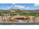 Aerial view of the home with a desert landscape and nearby golf course at 9161 E Superstition Mountain Dr, Gold Canyon, AZ 85118
