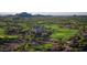 Gorgeous aerial view of golf course community showcasing stunning views of well maintained fairways and lush surroundings at 9161 E Superstition Mountain Dr, Gold Canyon, AZ 85118