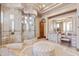 Stunning bathroom with a glass shower, vanity, makeup table and ottoman at 9161 E Superstition Mountain Dr, Gold Canyon, AZ 85118