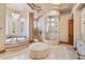 A luxurious bathroom with a freestanding tub and glass enclosed shower at 9161 E Superstition Mountain Dr, Gold Canyon, AZ 85118