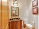 Charming powder room with a unique mirror and stylish fixtures at 9161 E Superstition Mountain Dr, Gold Canyon, AZ 85118