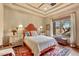 Cozy bedroom with decorative rug, bright window, and dual night stands at 9161 E Superstition Mountain Dr, Gold Canyon, AZ 85118