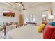 Spacious bedroom with wooden floors, a ceiling fan, and decorated with art at 9161 E Superstition Mountain Dr, Gold Canyon, AZ 85118
