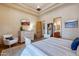 Bedroom with tray ceiling and access to the ensuite bath and outdoor areas at 9161 E Superstition Mountain Dr, Gold Canyon, AZ 85118