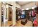 Spacious walk-in closet with custom shelving, hardwood floors, and full-length mirror at 9161 E Superstition Mountain Dr, Gold Canyon, AZ 85118