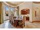 Dining room with views, a chandelier, elegant chairs, and hardwood floors at 9161 E Superstition Mountain Dr, Gold Canyon, AZ 85118