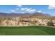 Expansive estate home nestled in a scenic desert landscape overlooking a lush golf course and mountains at 9161 E Superstition Mountain Dr, Gold Canyon, AZ 85118