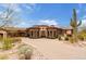 Expansive desert home with a private brick driveway and beautiful desert landscaping at 9161 E Superstition Mountain Dr, Gold Canyon, AZ 85118