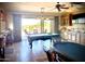 Spacious game room with a pool table, wet bar, and sliding doors leading to the outdoor patio at 9161 E Superstition Mountain Dr, Gold Canyon, AZ 85118