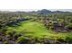 Scenic aerial shot of the golf course featuring lush green fairways, sand traps, and desert landscaping at 9161 E Superstition Mountain Dr, Gold Canyon, AZ 85118