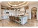 A gourmet kitchen featuring a large island with seating and elegant finishes at 9161 E Superstition Mountain Dr, Gold Canyon, AZ 85118
