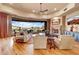 Spacious living room with floor to ceiling windows and fireplace at 9161 E Superstition Mountain Dr, Gold Canyon, AZ 85118