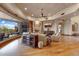Cozy living room offers a stone fireplace, hardwood floors, and lots of light at 9161 E Superstition Mountain Dr, Gold Canyon, AZ 85118