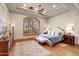 A relaxing bedroom featuring a seating area, a large window and beautiful hardwood floors at 9161 E Superstition Mountain Dr, Gold Canyon, AZ 85118