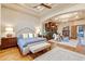 A spacious bedroom with sitting area, chandelier and beautiful hardwood floors at 9161 E Superstition Mountain Dr, Gold Canyon, AZ 85118