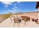 Outdoor patio with comfortable seating and fire pit, perfect for enjoying views of the surrounding landscape at 9161 E Superstition Mountain Dr, Gold Canyon, AZ 85118