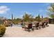 Relaxing pool area with desert views, rock waterfall feature, and comfortable lounge chairs at 9161 E Superstition Mountain Dr, Gold Canyon, AZ 85118