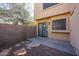 Backyard patio with privacy wall and sliding glass door at 921 W University Dr # 1099, Mesa, AZ 85201