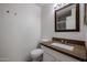 Bathroom featuring granite countertop vanity, toilet, and mirror at 921 W University Dr # 1099, Mesa, AZ 85201