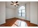 Bedroom featuring hardwood floors and a large window at 921 W University Dr # 1099, Mesa, AZ 85201