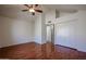 Empty bedroom with hardwood floors, white walls, and a closet at 921 W University Dr # 1099, Mesa, AZ 85201