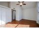 Bright bedroom with hardwood floors, ceiling fan, and closet at 921 W University Dr # 1099, Mesa, AZ 85201