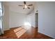 Sunlit bedroom featuring hardwood floors and ample closet space at 921 W University Dr # 1099, Mesa, AZ 85201