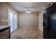 Bright Dining area with tile flooring, sliding glass doors, and a ceiling fan at 921 W University Dr # 1099, Mesa, AZ 85201