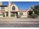 Exterior view of a two-story home with a red tile roof and desert landscaping at 921 W University Dr # 1099, Mesa, AZ 85201