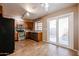 Bright kitchen with stainless appliances and a large sliding glass door at 921 W University Dr # 1099, Mesa, AZ 85201