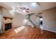 Bright living room featuring a fireplace, staircase, and hardwood floors at 921 W University Dr # 1099, Mesa, AZ 85201