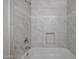 Tiled shower featuring a built-in soap niche and shower head at 921 W University Dr # 1099, Mesa, AZ 85201