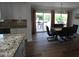 Dining room with table and chairs, with an open view of the backyard through sliding glass doors at 10309 W Twin Oaks Dr, Sun City, AZ 85351