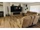 Inviting living room with modern fireplace, neutral-toned seating, and stylish decor at 10309 W Twin Oaks Dr, Sun City, AZ 85351