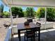 A covered patio features outdoor seating overlooking a large backyard area at 10309 W Twin Oaks Dr, Sun City, AZ 85351