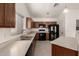 Well-equipped kitchen featuring wood cabinets, stainless steel appliances, and ample counter space for meal prep at 10312 W Mazatlan Dr, Arizona City, AZ 85123