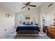 Bright bedroom featuring a ceiling fan, vaulted ceilings and southwest-themed decor at 10718 E Fenimore Rd, Mesa, AZ 85207