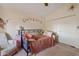 Inviting bedroom with vaulted ceiling, a comfy chair, and a comfortable bed at 10718 E Fenimore Rd, Mesa, AZ 85207