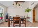 This dining room features natural light, tile floors, and a modern ceiling fan at 10718 E Fenimore Rd, Mesa, AZ 85207