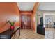 Welcoming foyer features a double-door entry, tile flooring, and warm, inviting colors at 10718 E Fenimore Rd, Mesa, AZ 85207
