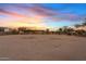 Large horse arena with sturdy fencing provides ample space for training and riding activities at 10718 E Fenimore Rd, Mesa, AZ 85207