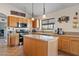 Functional kitchen boasts a center island, ample counter space, and stainless steel appliances at 10718 E Fenimore Rd, Mesa, AZ 85207